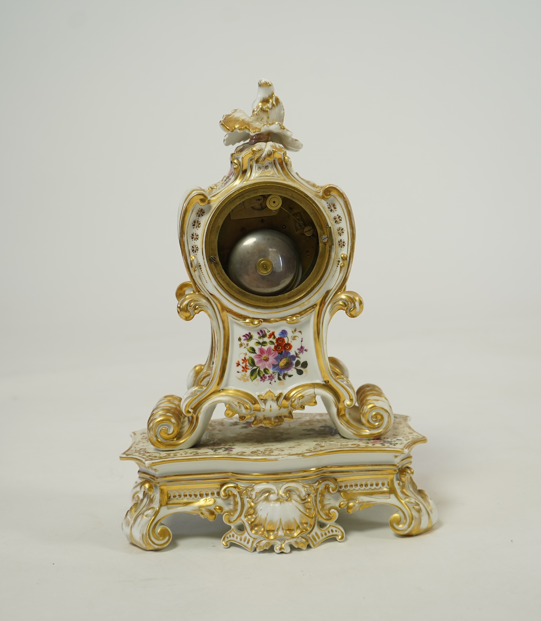 A mid 19th century French porcelain floral and gilt decorated clock, by Jacob Petit